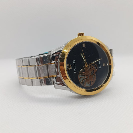 Wristwatch with gold and silver band on a white background