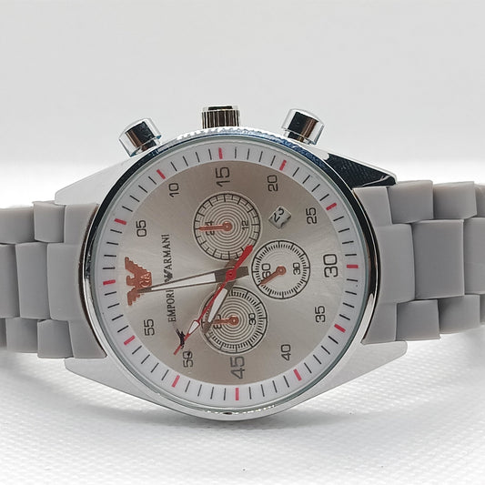Gray wristwatch with a detailed face on a white background