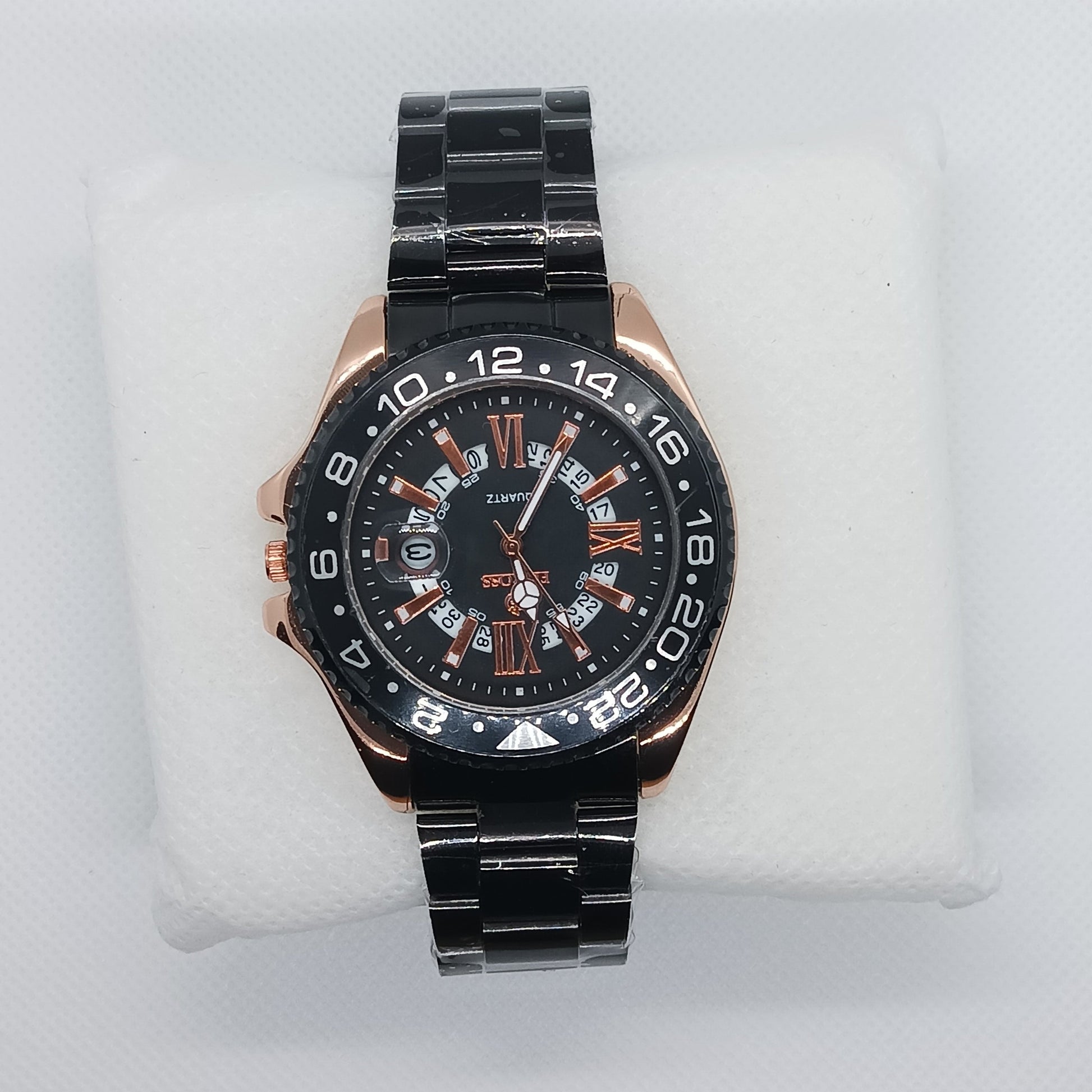 Black wristwatch with detailed face on a white mannequin hand
