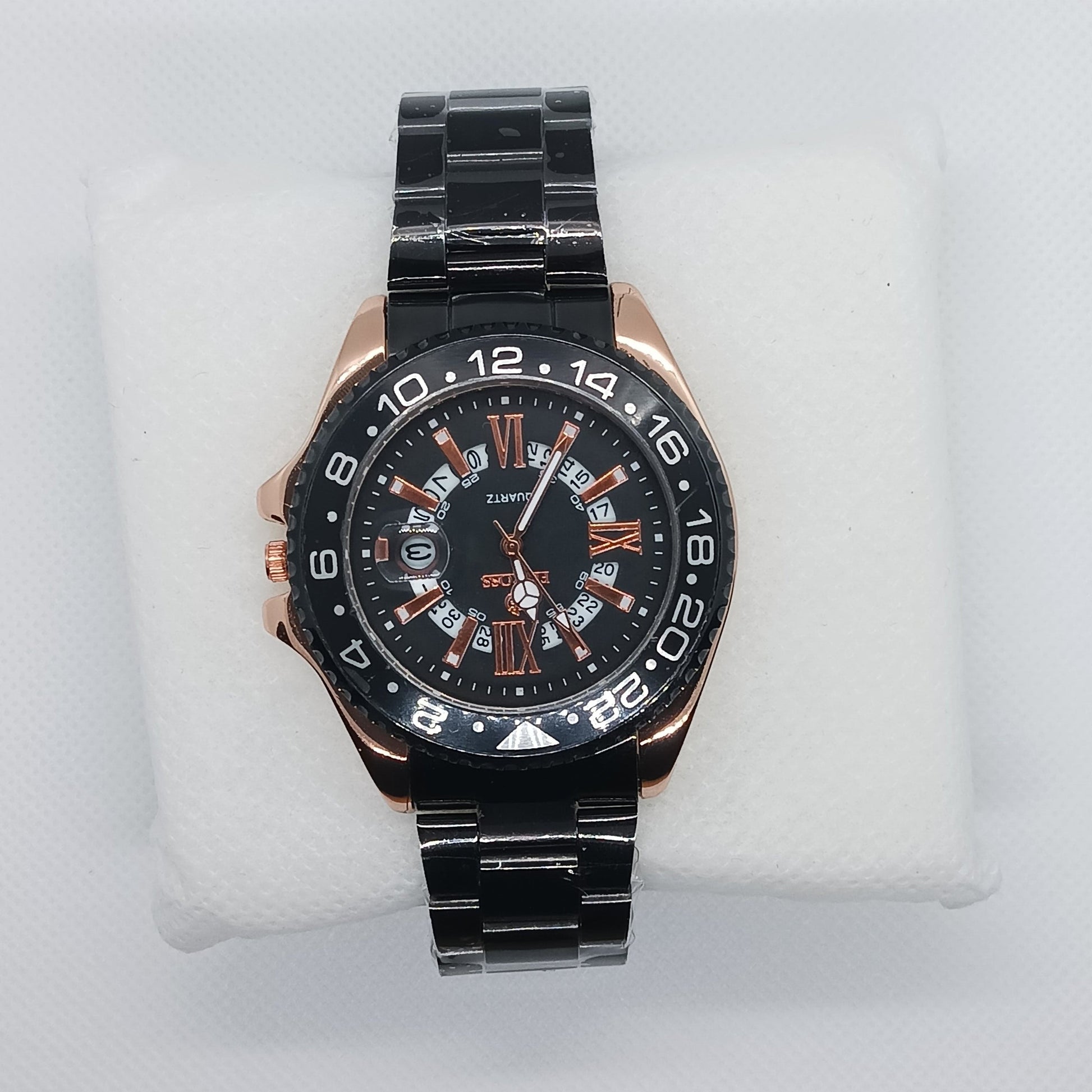 Black wristwatch with detailed face on a white mannequin hand
