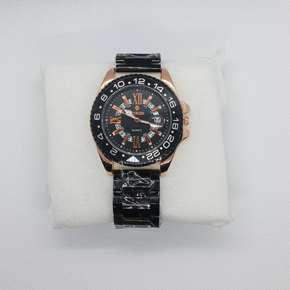 Luxury watch with black and rose gold design on a white cushion