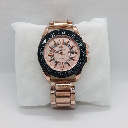Rose gold watch with a detailed face on a white cushion against a light gray background