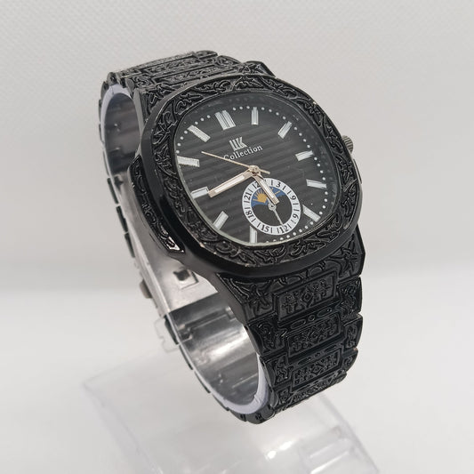 Black ornate watch on a white background