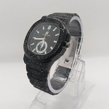Black textured watch with clear plastic packaging on a white background
