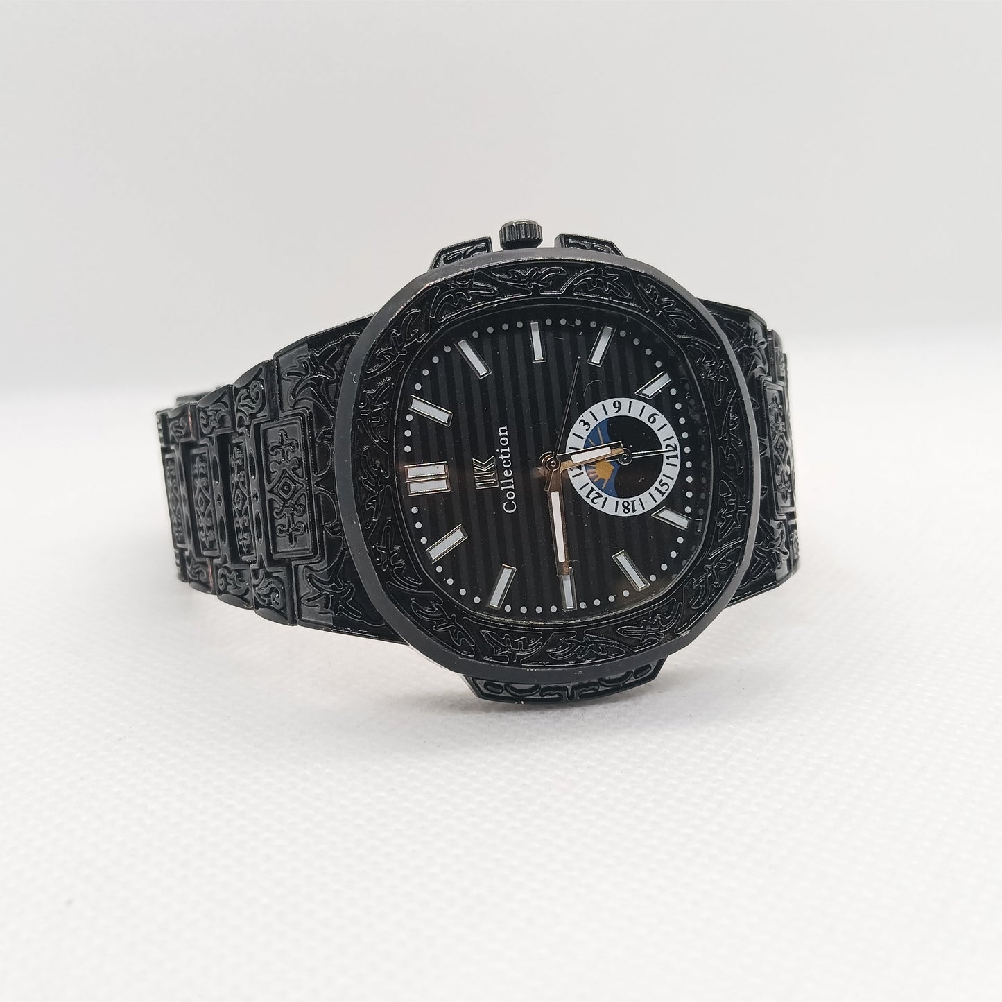 Black wristwatch with detailed design on a white background