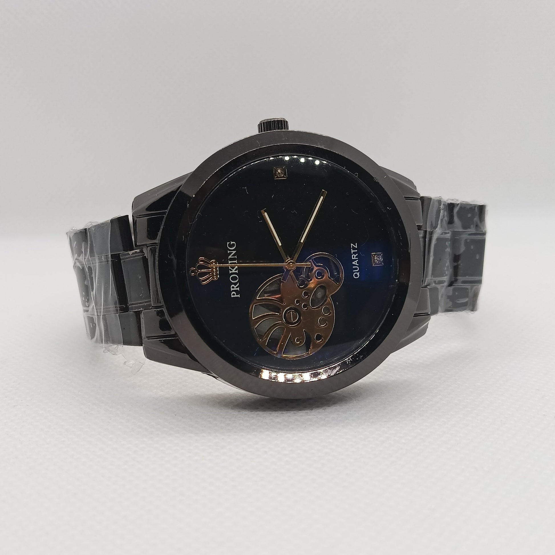 Black wristwatch with detailed face on a white background