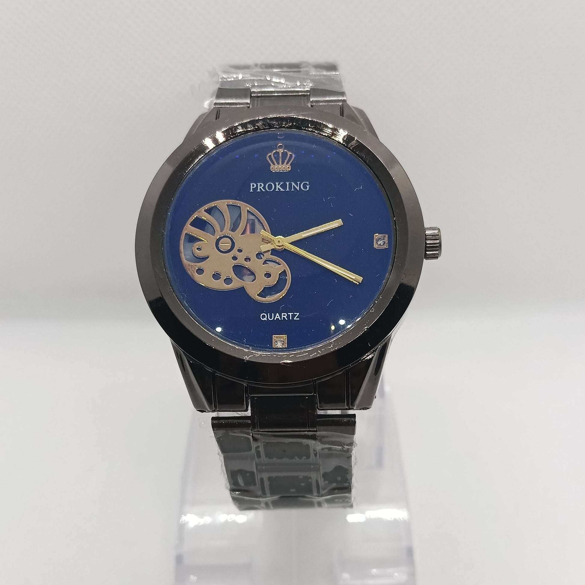 Watch with blue face and black strap on a white background