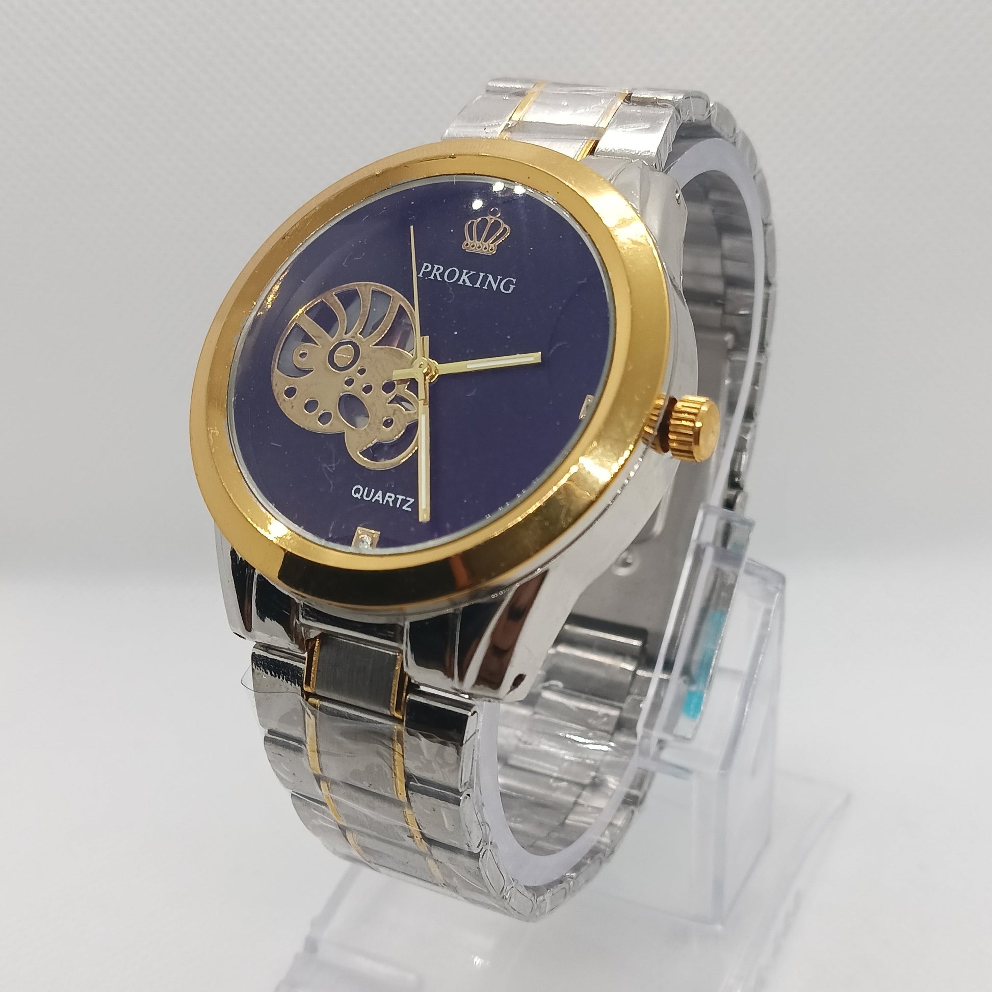 Wristwatch with gold and silver band on a white background