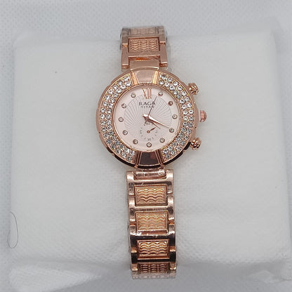 Rose gold watch with diamond-studded face on a light gray background