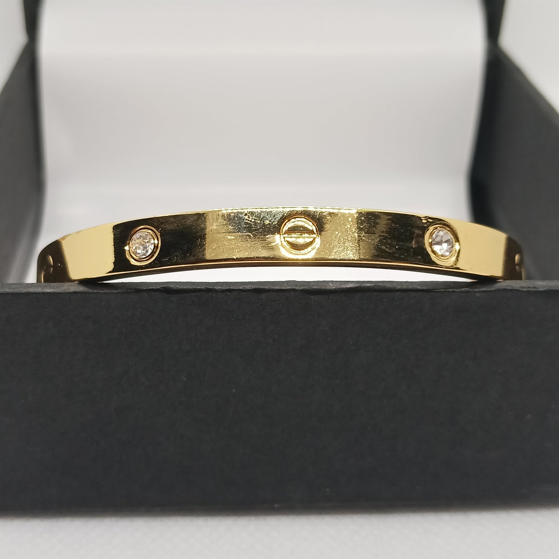 Gold bracelet with diamonds in a black box