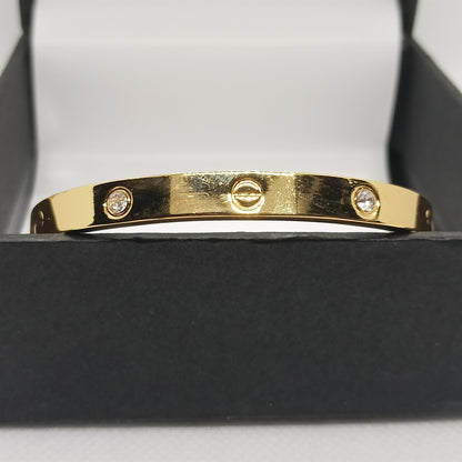 Gold bracelet with diamonds in a black box