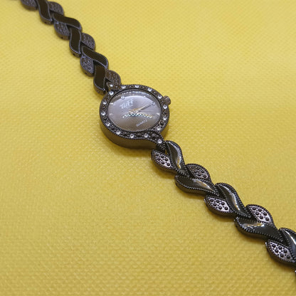 Bracelet with braided design on a yellow background