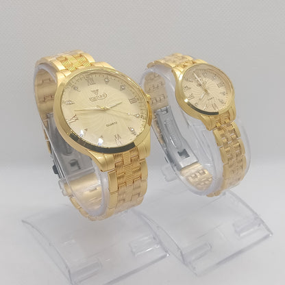 Two gold wristwatches on a white background