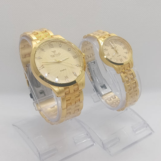 Two gold wristwatches on a white background