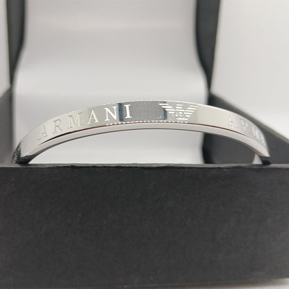 Silver Armani bracelet on a black box