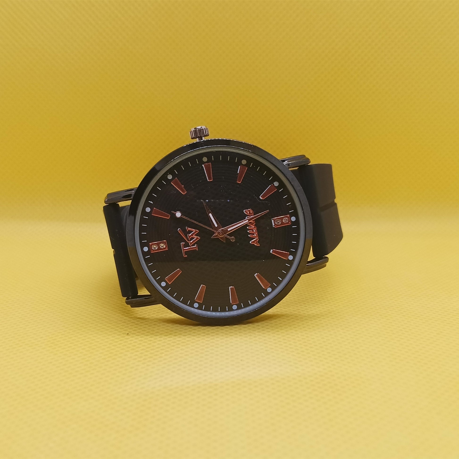 Black watch with red accents on a yellow background