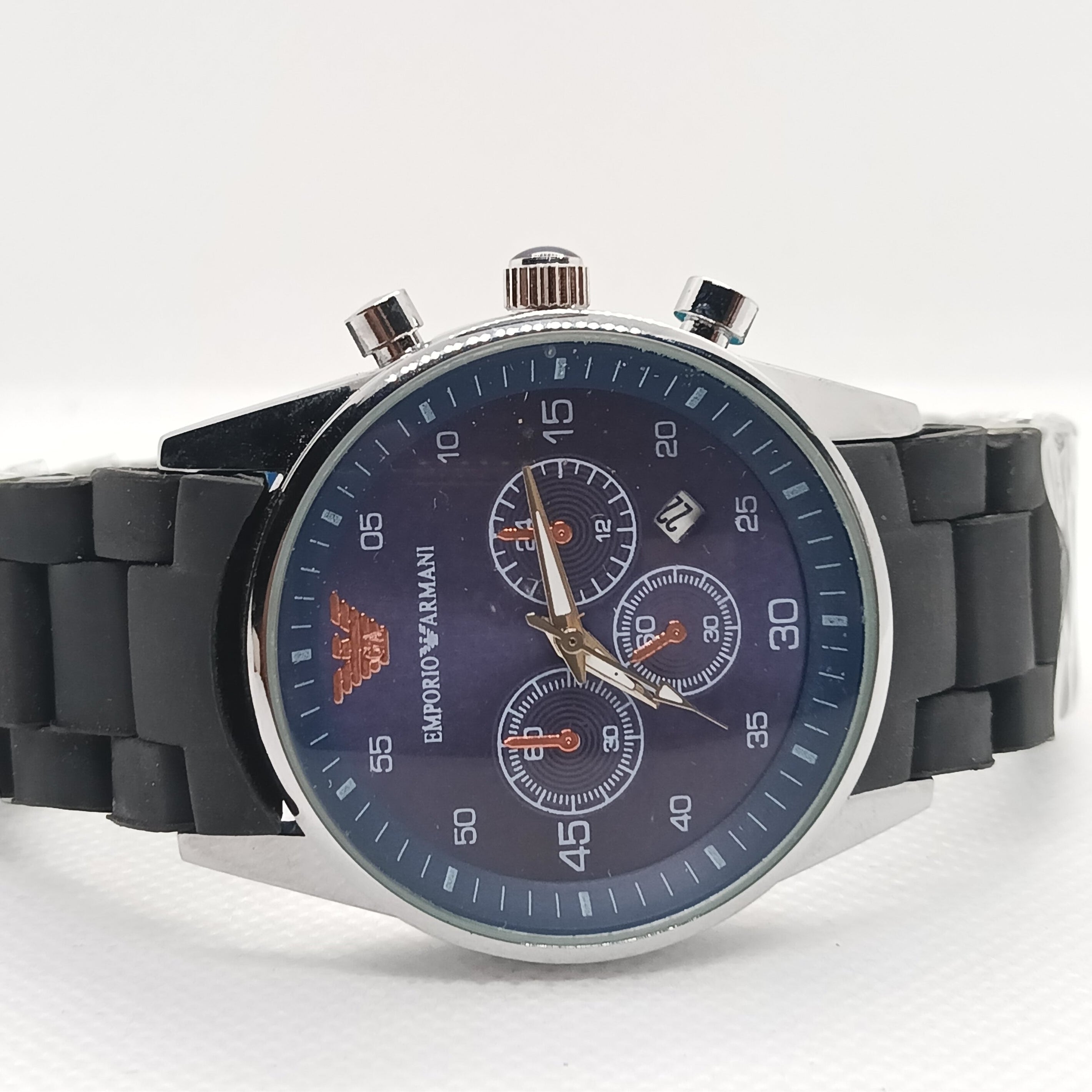 Wristwatch with black strap and blue dial on a white background