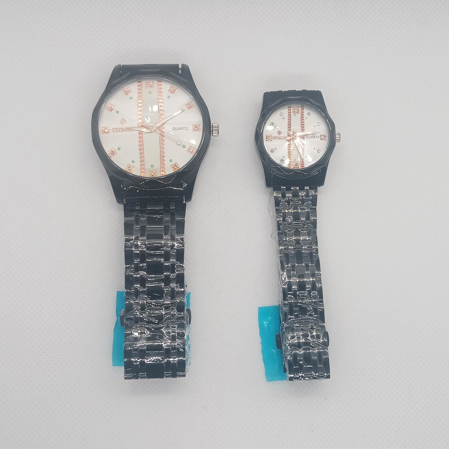 Two watches with unique designs on a gray background