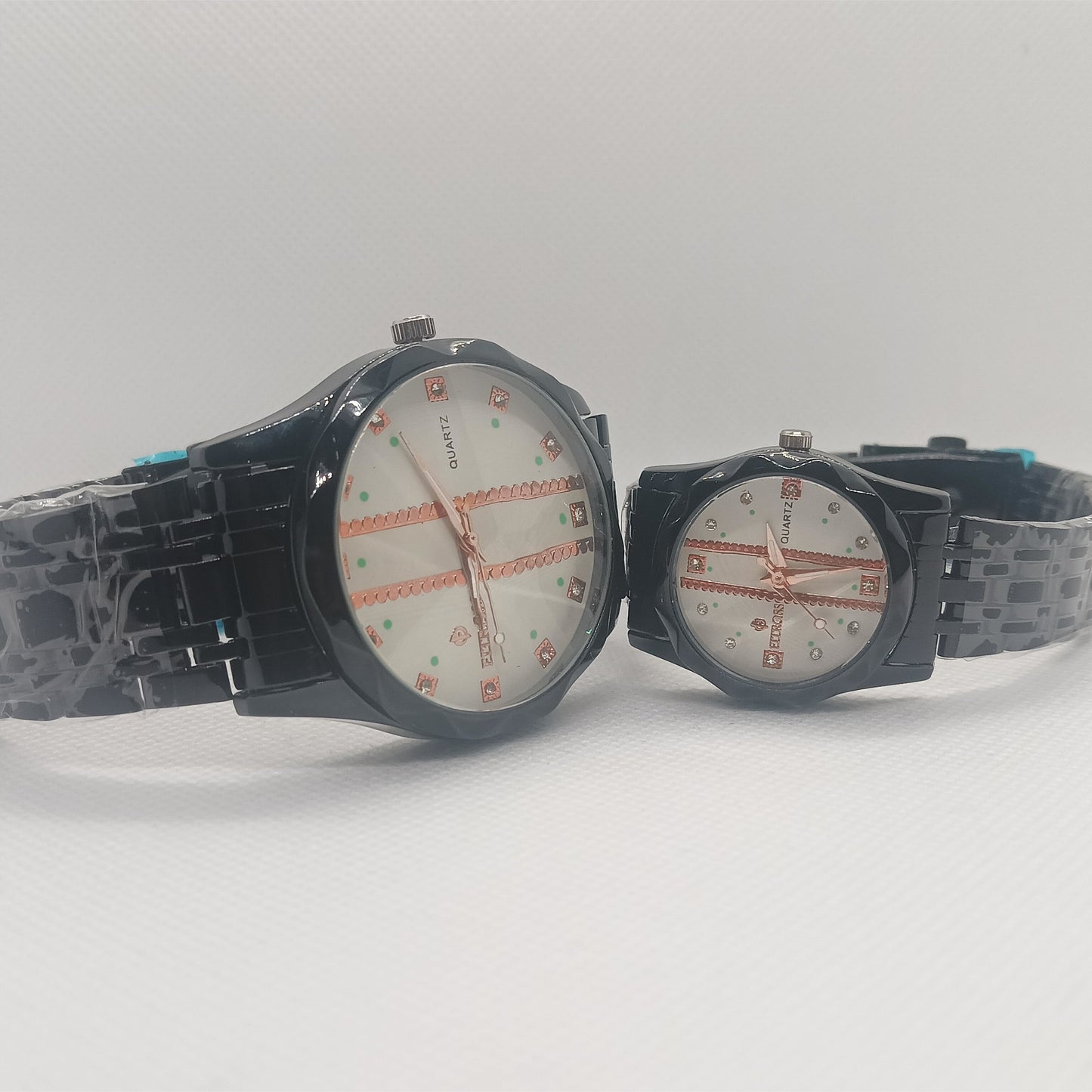 Two watches with black straps on a white background