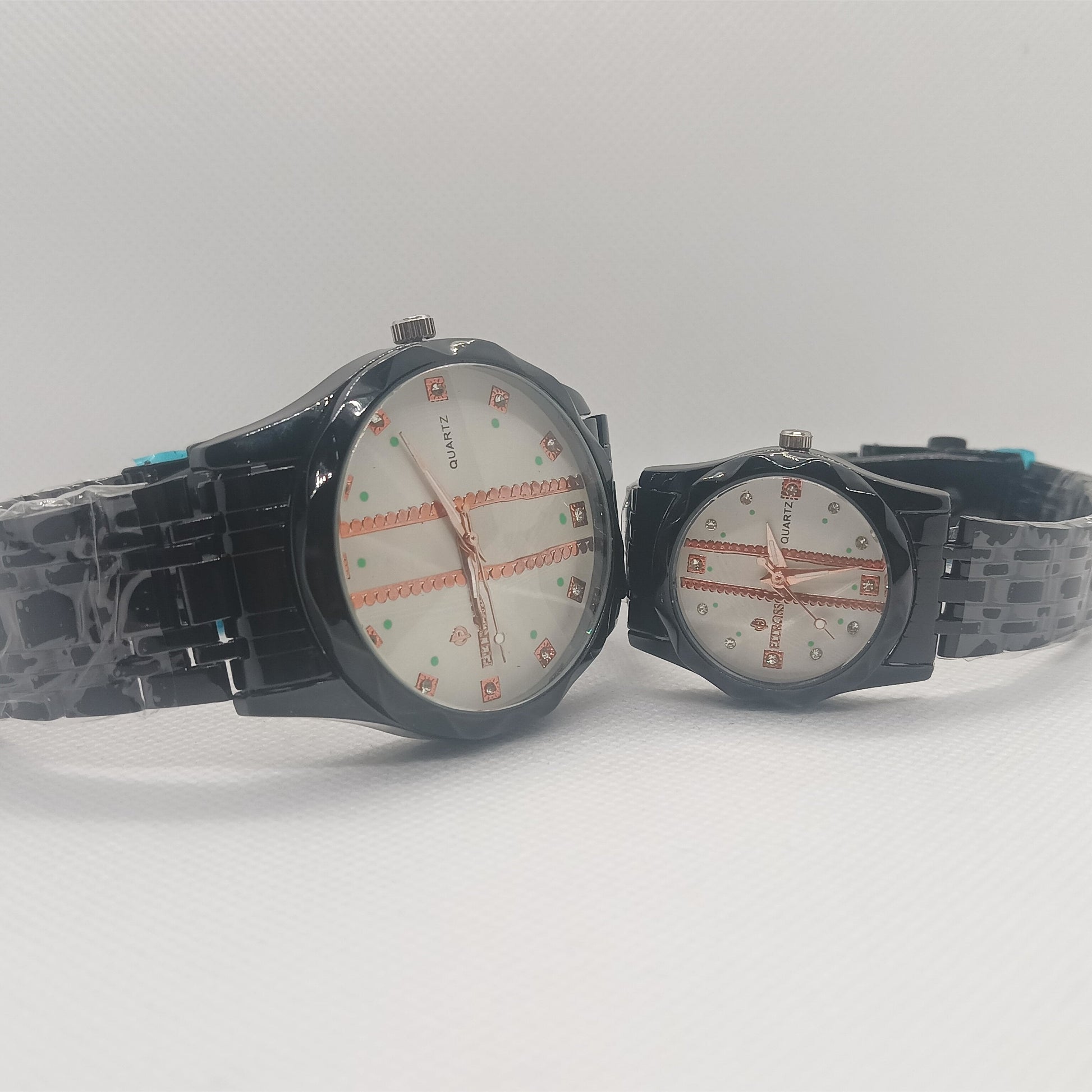 Two watches with black straps on a white background