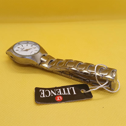Metallic watch with a visible brand tag on a yellow background