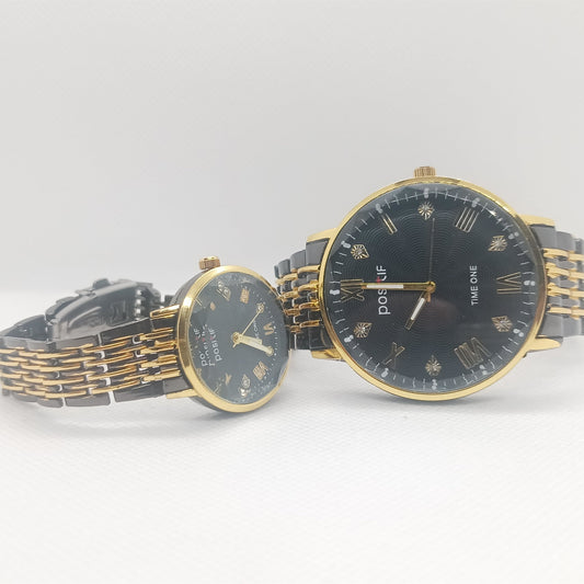 Two gold and black watches on a white background
