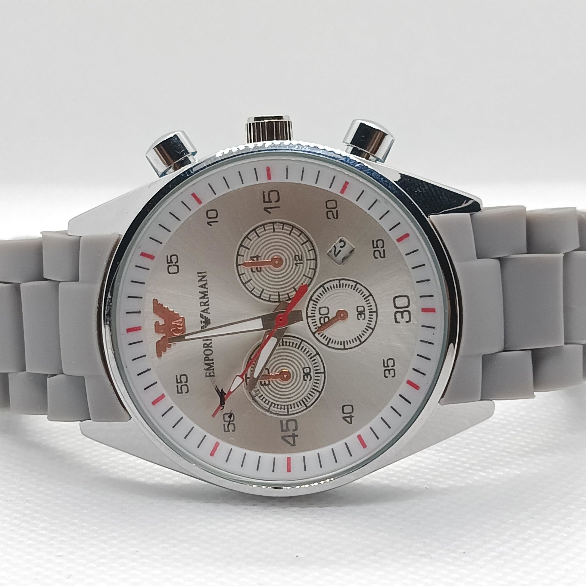 Gray watch with a detailed face on a white background