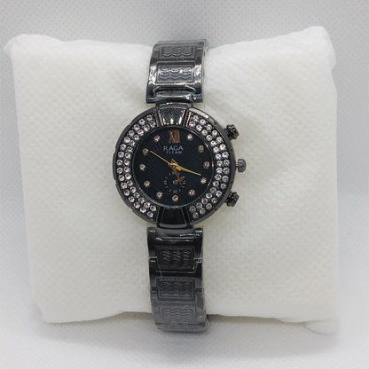 Black watch with black face on a white cushion