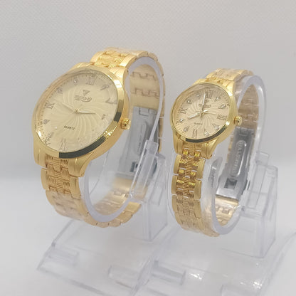 Two gold wristwatches on a white background