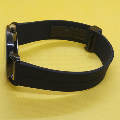 Black belt with metal buckle on a yellow background