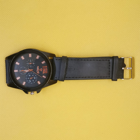 Black wristwatch with a detailed face on a yellow background