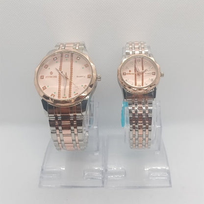 Two watches on a clear stand against a white background