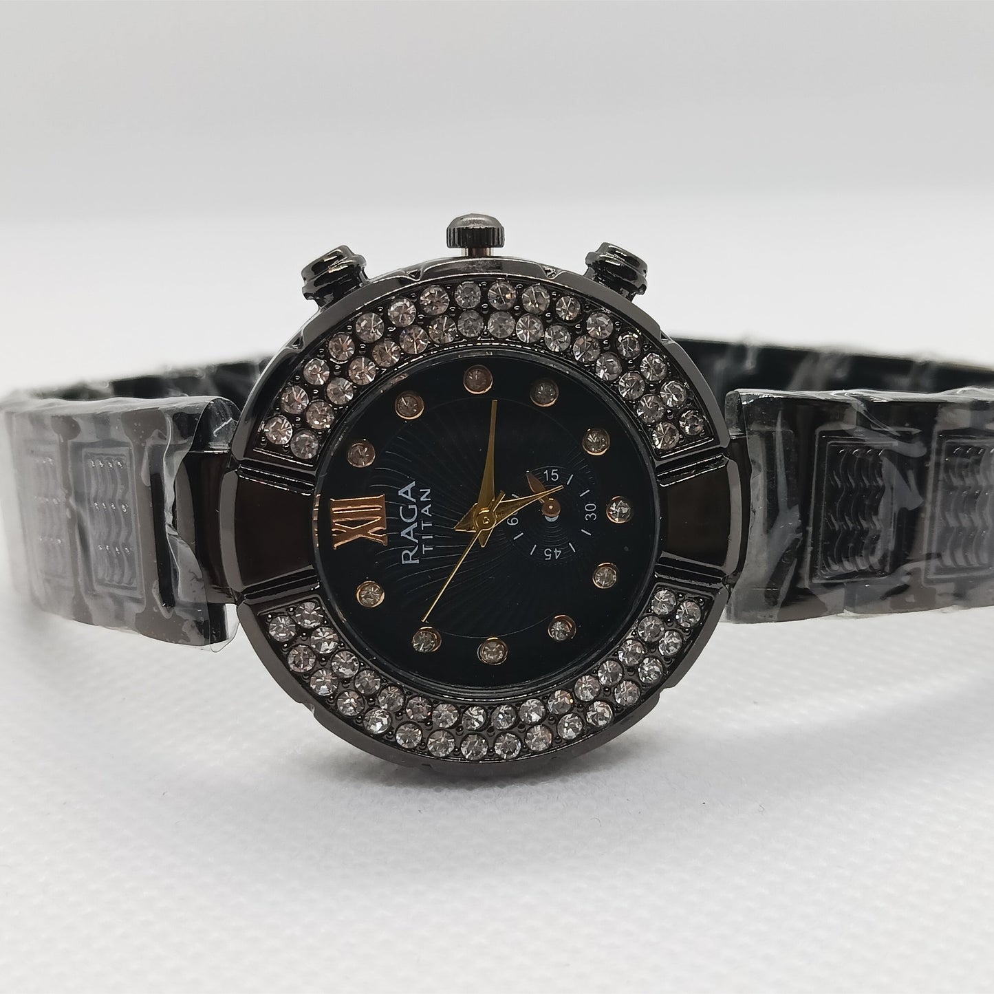 Black watch with decorative band on a white background