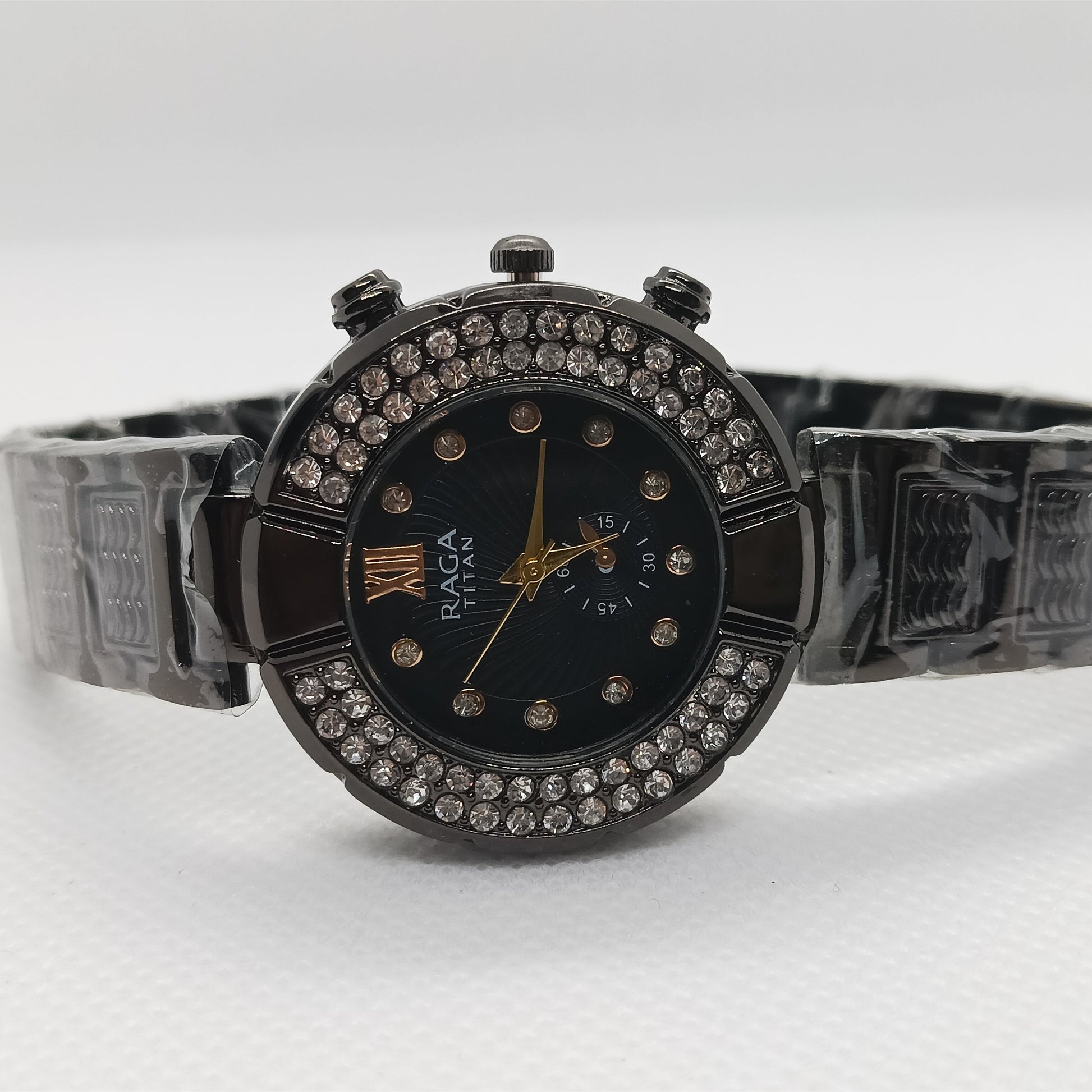 Black watch with decorative band on a white background