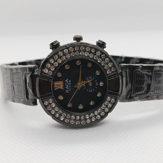 Black watch with decorative band on a white background