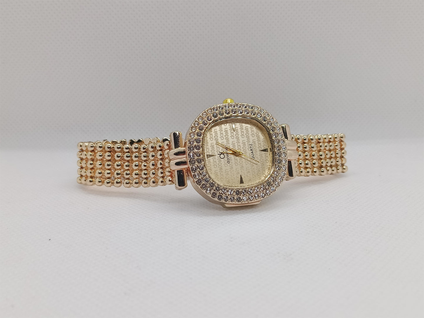 Elegant Champagne Gold Dial with Crystal Bezel