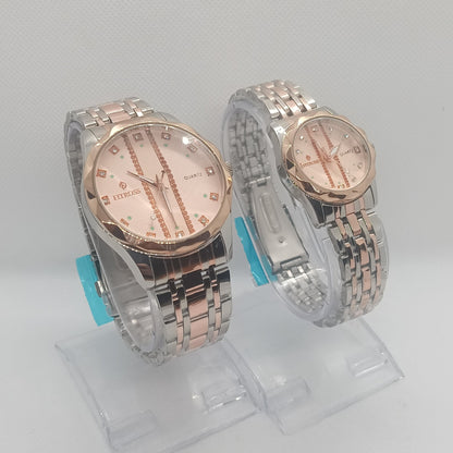 Two silver and rose gold watches on a white background