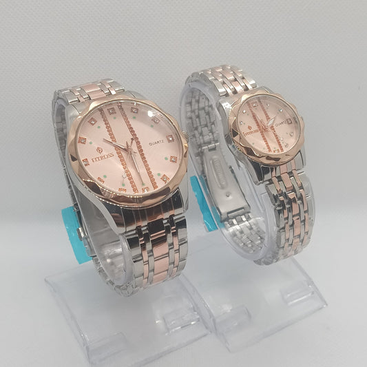Two silver and rose gold watches on a white background