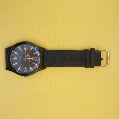 Black wristwatch with blue face on a yellow background