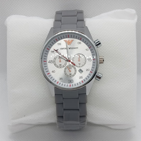 Gray wristwatch with a detailed face on a white cushion