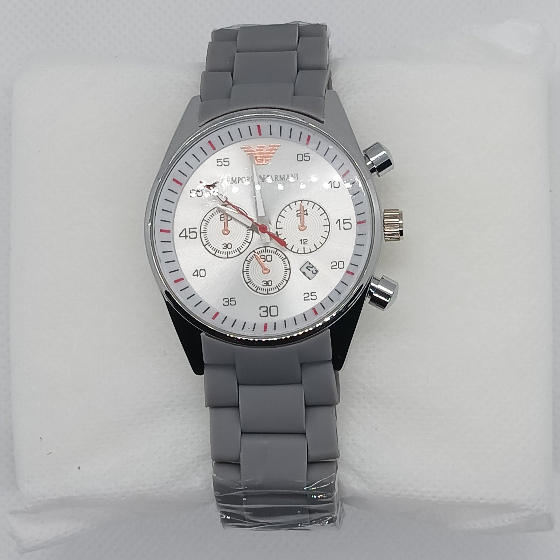 Gray wristwatch with a detailed face on a white background