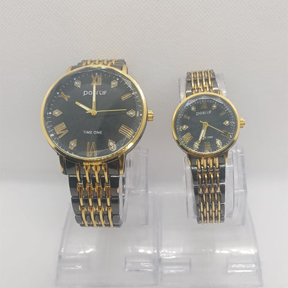 Two gold and black watches on a white background